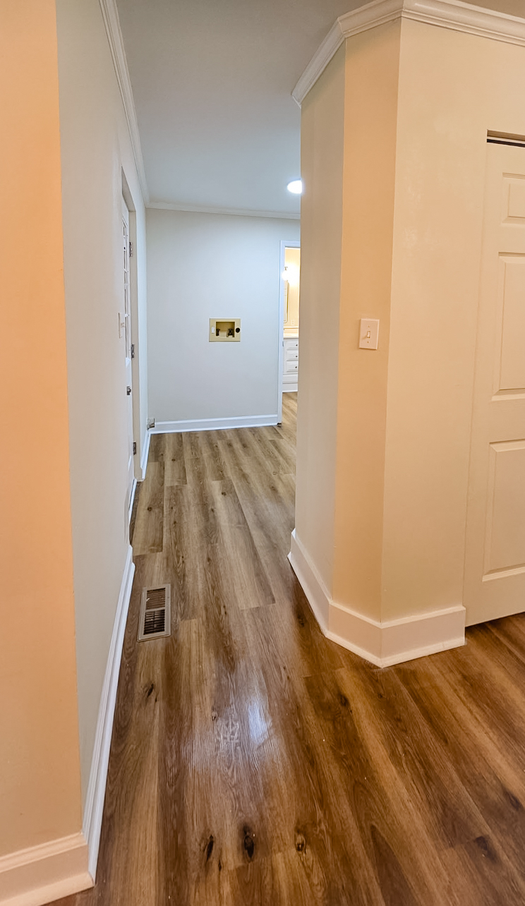 new floors and paint in a hallway by Wynn Building Construction