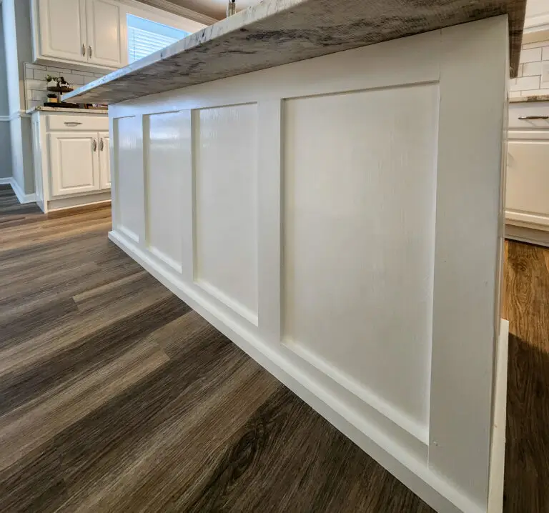 detailed view of kitchen island trim work and new flooring by Wynn Building Construction