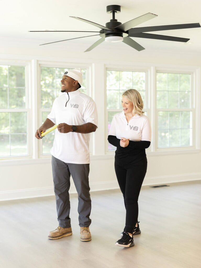 smiling couple in a newly renovated room